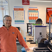 Quiballo standing with maker equipment